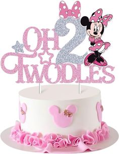 a minnie mouse birthday cake topper with the number two on it's side