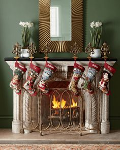 a fireplace with stockings hanging from it's mantle