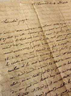 an old handwritten letter with writing on it