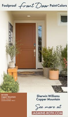 the front door is painted brown and has potted plants