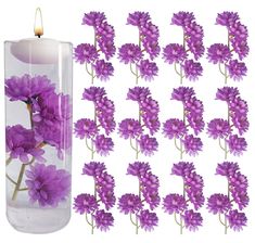 purple flowers in a glass vase with candles