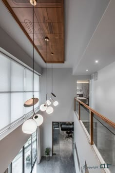 an overhead view of a modern house with wood and glass accents, including pendant lights