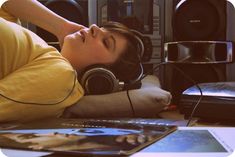 a person laying down with headphones on