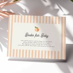 an orange and white striped business card with the words shaker for baby on it