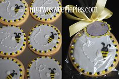 some decorated cookies in the shape of bees