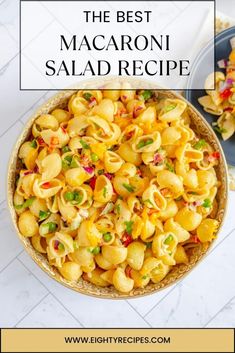 the best macaroni salad recipe in a bowl on top of a white table