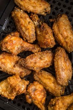 chicken wings are fried and seasoned in oil