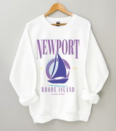 "These Sweatshirts Fit True To Size We suggest a size up for a looser fit. We urge you to use the size charts provided on every item's listing The \"Newport Vintage Style Sailing\" crewneck is a pre-shrunk, classic fit sweater that's made with air-jet spun yarn for a soft feel and reduced pilling. A classic look, perfect everyday favorite or lounge wear sweatshirt. Whether on vacation or local, this comfy and trendy sweatshirt, inspired by Stradivarius and vintage 90's Polo sweatshirts, will be Crew Neck Graphic Print Top For Sailing, Casual White Tops For Sailing, Casual White Top For Sailing, Preppy Prints, Hat Inspiration, East Coast Style, Newport Rhode Island, University Sweatshirts, Polo Sweatshirt