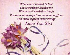 a bouquet of flowers sitting on top of a table next to a card with the words love you siss