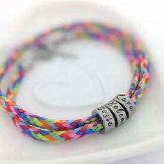 "Rainbow bracelet, rainbow gifts for women, birthday gift for girls teens, rainbow gifts, rainbow jewellery, teenage girl gift, bracelet girl This personalised rainbow cord bracelet would make the perfect birthday gift for a best friend, a daughter or a sister. Ideal for teenage girls and young women. Girls' or women's wraparound rainbow paracord bracelet with personalised stainless steel rings. Each ring is engraved with your own text, you can choose the number of rings included. Apart from a r