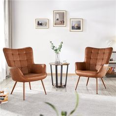 two brown chairs sitting next to each other on top of a white carpeted floor