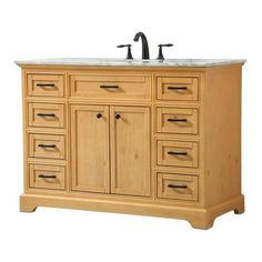 a bathroom vanity with two sinks and drawers