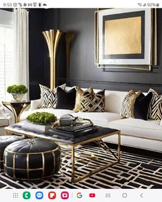 a black and white living room with gold accents