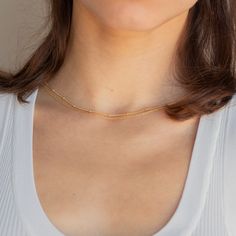 B E A D E D ∙ D U O ∙ C H A I N ∙ N E C K L A C E Get two in one with our minimalist Beaded Duo Chain necklace. With one satellite chain and one dainty chain layered together, this choker necklace gives the illusion that you put in the extra effort when you really spent the extra time in bed. * Material: High Quality Solid 925 Sterling Silver * Finish: Sterling Silver ∙ 18K Gold * Featuring a Minimalist Chain layered with a Dainty Beaded Chain, adjustable length 16 inches to 18 inches. H O W ∙ T Minimalist Double Chain Necklace, Minimalist Adjustable Double Chain Necklaces, Adjustable Double Chain Necklace For Everyday, Minimalist Everyday Jewelry With Double Chain, Minimalist Double Chain Layered Necklace For Everyday, Minimalist Double Strand Layered Necklace, Minimalist Double Strand Clavicle Chain Layered Necklace, Simple Everyday Layered Necklace With Delicate Chain, Minimalist Double Strand Layered Necklace For Everyday