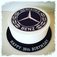 a birthday cake with the mercedes benz logo on it