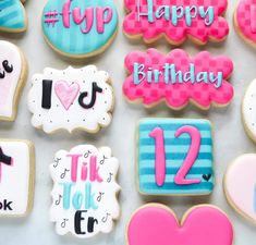 decorated cookies are arranged on a table for someone's 12th birthday party or special occasion