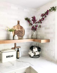 the kitchen counter is clean and ready to be used as a storage area for cooking utensils