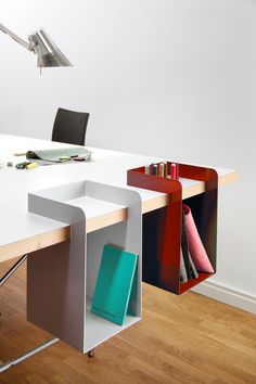 an office desk with two bookshelves attached to it