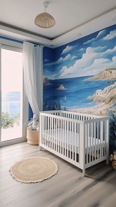 Cozy gender-neutral nursery featuring a blue Crete mural, white crib, natural furniture, and a serene sea view.