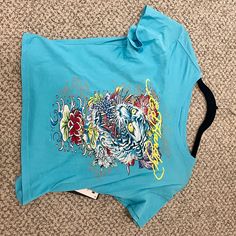 Brand New Urban Decay Ed Hardy Crop Top From July 2023. Originally $45.00. Significant Discount And Great Quality. Blue Y2k Top With Graphic Print, Blue Y2k Summer Tops, Blue Graphic Print Crop Top T-shirt, Blue Y2k Tops For Summer, Blue Fitted Printed T-shirt, Casual Light Blue Printed T-shirt, Fitted Blue Printed T-shirt, Blue Summer Streetwear Tops, Light Blue Printed Casual Tops