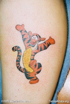 a person with a winnie the pooh tattoo on their leg