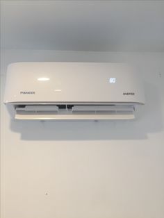 a white air conditioner mounted on the wall