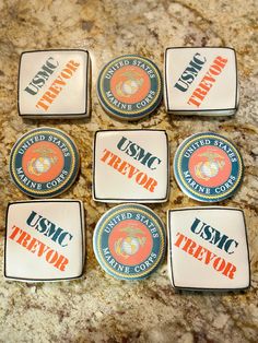 six usmc trays sitting on top of a marble counter