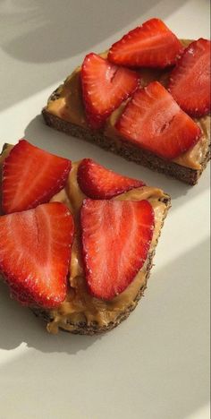 two slices of toast with strawberries on top