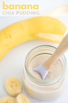 banana and chia pudding in a glass jar with a wooden spoon next to it