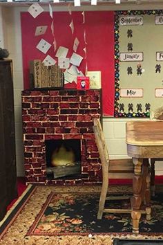 a room with a fire place, table and chairs in front of a brick fireplace