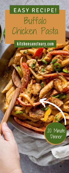 a pan filled with chicken and vegetables next to a hand holding a wooden spatula