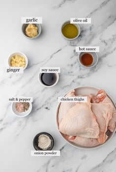 ingredients to make chicken broth laid out on a marble counter top