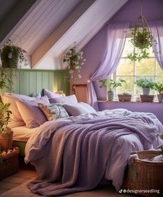 a bed in a bedroom with purple sheets and pillows