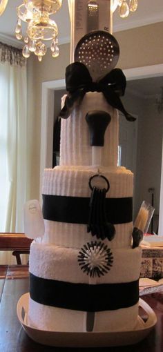 a cake made to look like a dog wearing a top hat and bow tie on it's head