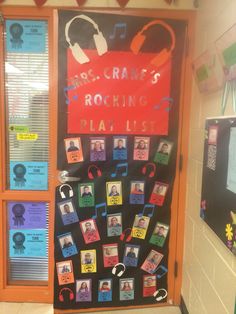 a bulletin board with pictures and headphones on it in front of a classroom door