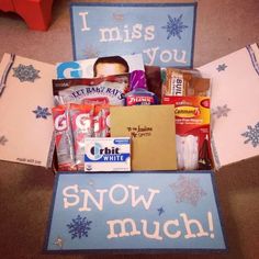 a box filled with various items and the words i miss you snow much on it