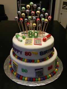 a birthday cake decorated with lots of candies and numbers on it's side