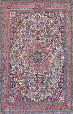 an antique persian rug with floral design on the center and blue, pink, red and white colors