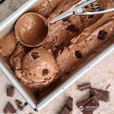 a pan filled with chocolate ice cream and spoons