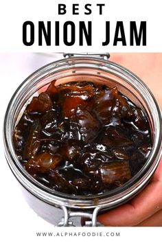 the best onion jam recipe is in a mason jar with text overlay that says,