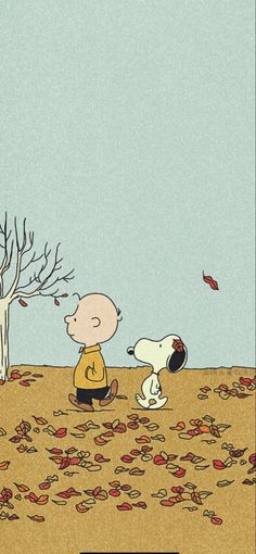 charlie brown and his dog are sitting in the fall leaves, looking at each other