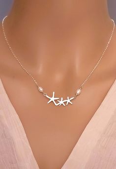 Look as elegant and chic with our Sterling Silver Starfish Necklace with tiny freshwater pearls accent.   DETAILS * Starfish is sterling silver, 32x14mm * Chain is Sterling Silver  Italian Rollo * Crafted in my home studio in Maine * Will be in a gift box ready for gift giving LENGTHs * Available in 14", 16", 18", 20"  * 2 inches extender with be included and attached »Shop for more STYLES @ http://www.femmartjewelry.etsy.com Get SOCIAL with me: * Instagram: @FemmartJewelry * Pinterest: https:// Ocean-inspired Silver Jewelry For Wedding, Silver Pearl Chain Jewelry For Beach, Elegant Silver Jewelry For Beach Wedding, Ocean-inspired Sterling Silver Jewelry For Wedding, Ocean-inspired Sterling Silver Jewelry For Weddings, Elegant Silver Starfish Jewelry, Elegant Starfish-shaped Pearl Charm Jewelry, Elegant Sterling Silver Jewelry With Starfish Charm, Elegant Silver Starfish Necklace