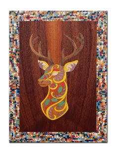 a painting of a deer's head on wood