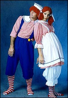 two people dressed in costume standing next to each other