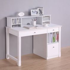 a white desk with two drawers and a book shelf