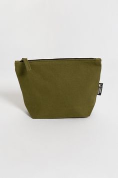 If you’ve been looking for an eco-friendly makeup bag to tame and organize cosmetic items, consider the simple and affordable Lok Pouch. Your purchase also supports Feeding America's campaign to end hunger by helping donate meals to kids and families in need. Size:  7"(H) x 9"(W) x 3"(D) Opening: 7 inches Made with 14-oz Certified Fairtrade Organic cotton canvas Long pull zipper YKK lead-free antique finish metal zippers All the accessories including zippers and fasteners are lead-free Made in a Functional Green Cosmetic Bag For Daily Use, Green Functional Cosmetic Bag For Everyday Use, Eco-friendly Everyday Cosmetic Pouch Bag, Eco-friendly Cosmetic Bag With Zipper For Daily Use, Everyday Green Zipper Pouch Cosmetic Bag, Everyday Green Pouch Cosmetic Bag, Green Everyday Pouch Cosmetic Bag, Eco-friendly Pouch Cosmetic Bag For Daily Use, Eco-friendly Travel Cosmetic Bag With Zipper