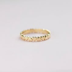 A heart eternity ring made of 14K solid gold. The ring is a heart band, so delicate and dainty that you will wear it forever. It can also be used as a simple wedding band or a thumb ring. This gold ring for women is ideal to be stacking, so you can make your own style. The best gift for her by Kyklos Jewelry. 100% handcrafted with love! ● Metal: 14K solid gold, 14K white gold  ● Width: 2.5 mm ● Choose from the drop down menus the available options (Metal, Ring size) and leave us a note for any special requirements. ● All our pieces are delivered beautifully packaged and gift ready.  ● Please keep in mind that each item is handcrafted and we need 5-7 days at least for its production. If you need your order on a specific date, please contact us. ● All orders are shipped worldwide via FedEx E Elegant Stackable Heart Ring, 14k Gold Stackable Rings With Heart Charm For Anniversary, Dainty Heart Cut Stackable Rings For Anniversary, Dainty Stackable Yellow Gold Heart Ring, Dainty Yellow Gold Stackable Heart Ring, Dainty Heart Cut Stackable Promise Rings, Delicate Stackable Heart Ring For Anniversary, 14k Gold Stackable Heart Cut Heart Ring, Yellow Gold Stackable Heart Cut Rings For Promise