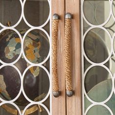 a close up of a glass door with a ball in the center and some circles around it