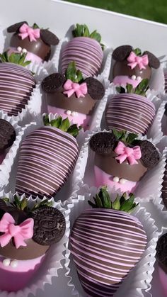 chocolate covered strawberries are arranged in the shape of heart - shaped hearts with pink bows