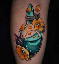 this is a tattoo with an image of a vase and flowers